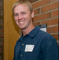 Bill Henningsgaard speaking at a celebration, July, 2008