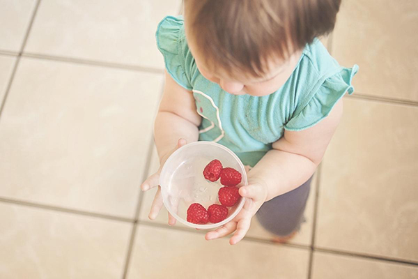 Baby offers food